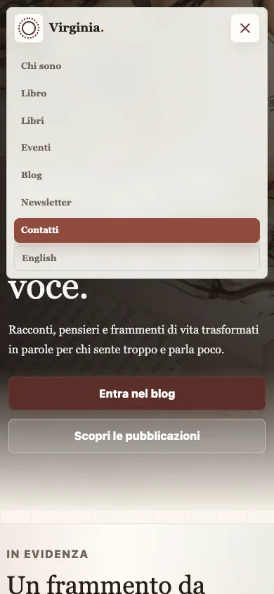 The navigation menu open over the homepage at 390 pixels wide.